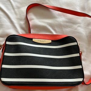 Brand new Henri Bendel crossbody in black, orange and white.